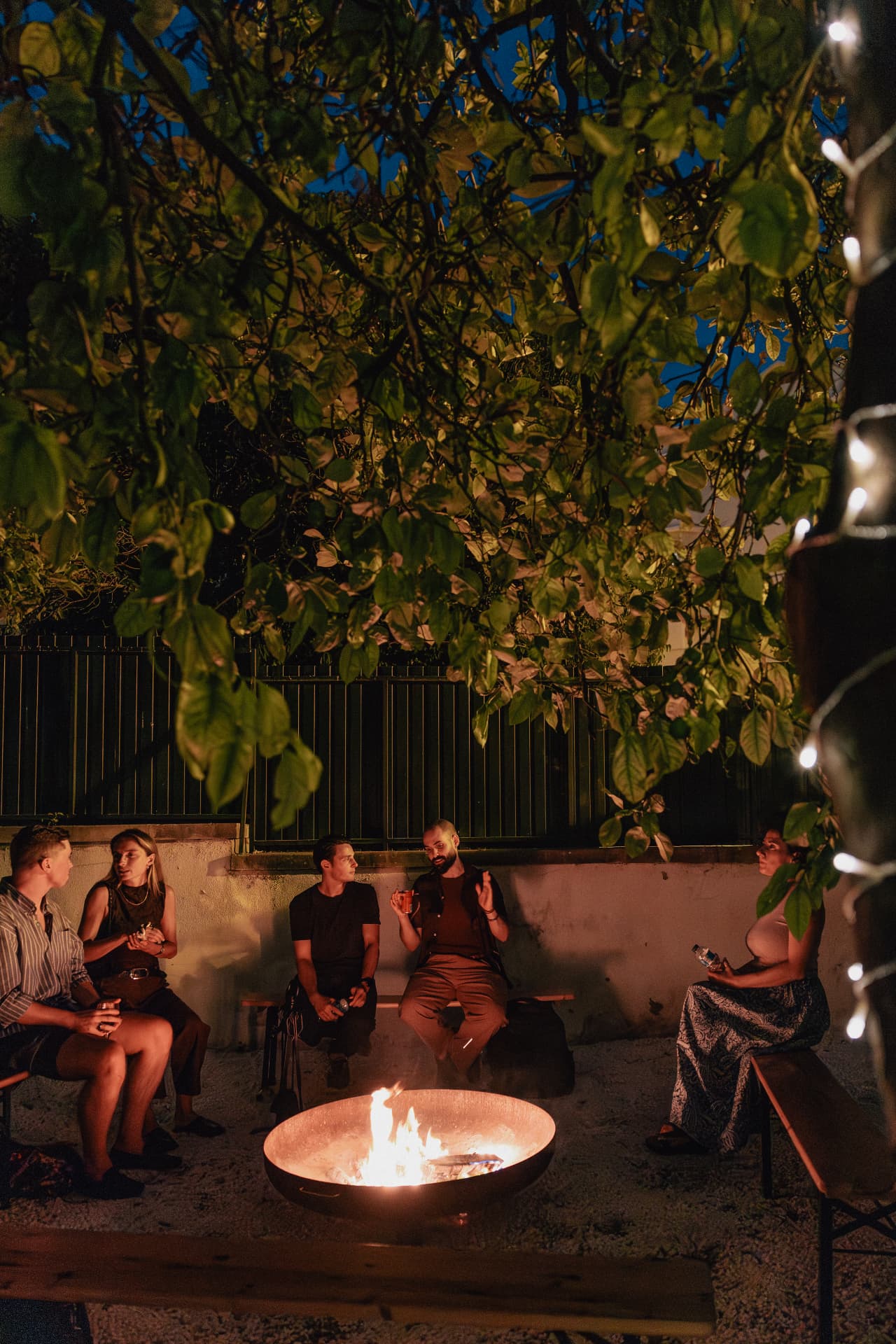Founders talking around the fire in the evening