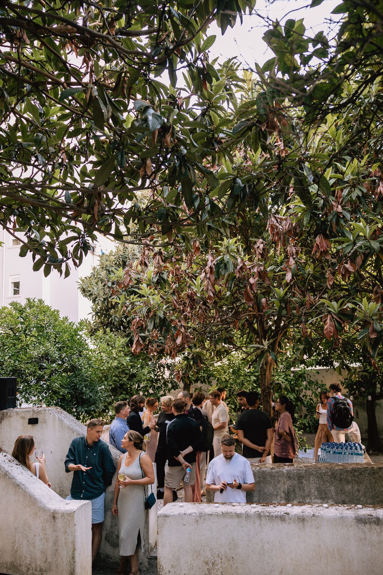 Guests gathering in the garden at a Founders Fire event